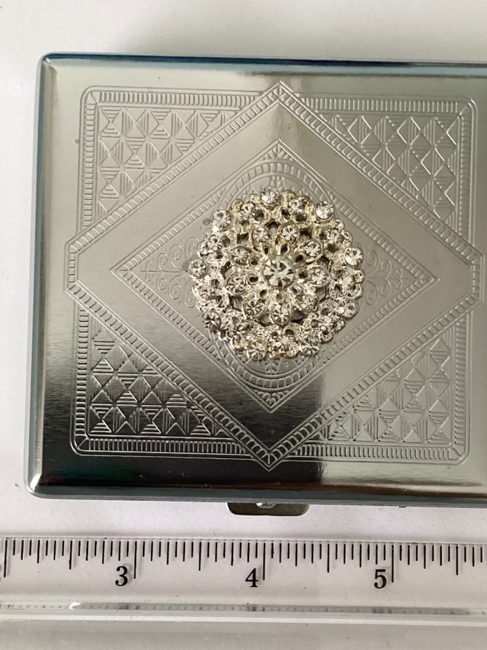 Silver tone hard metal case embellished with brilliant rhinestones….OOAK